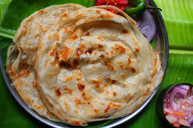 Flaky hand-slapped Malabar parotta with 30+ ghee-laminated layers at Café Malabar, Arab Street Singapore.