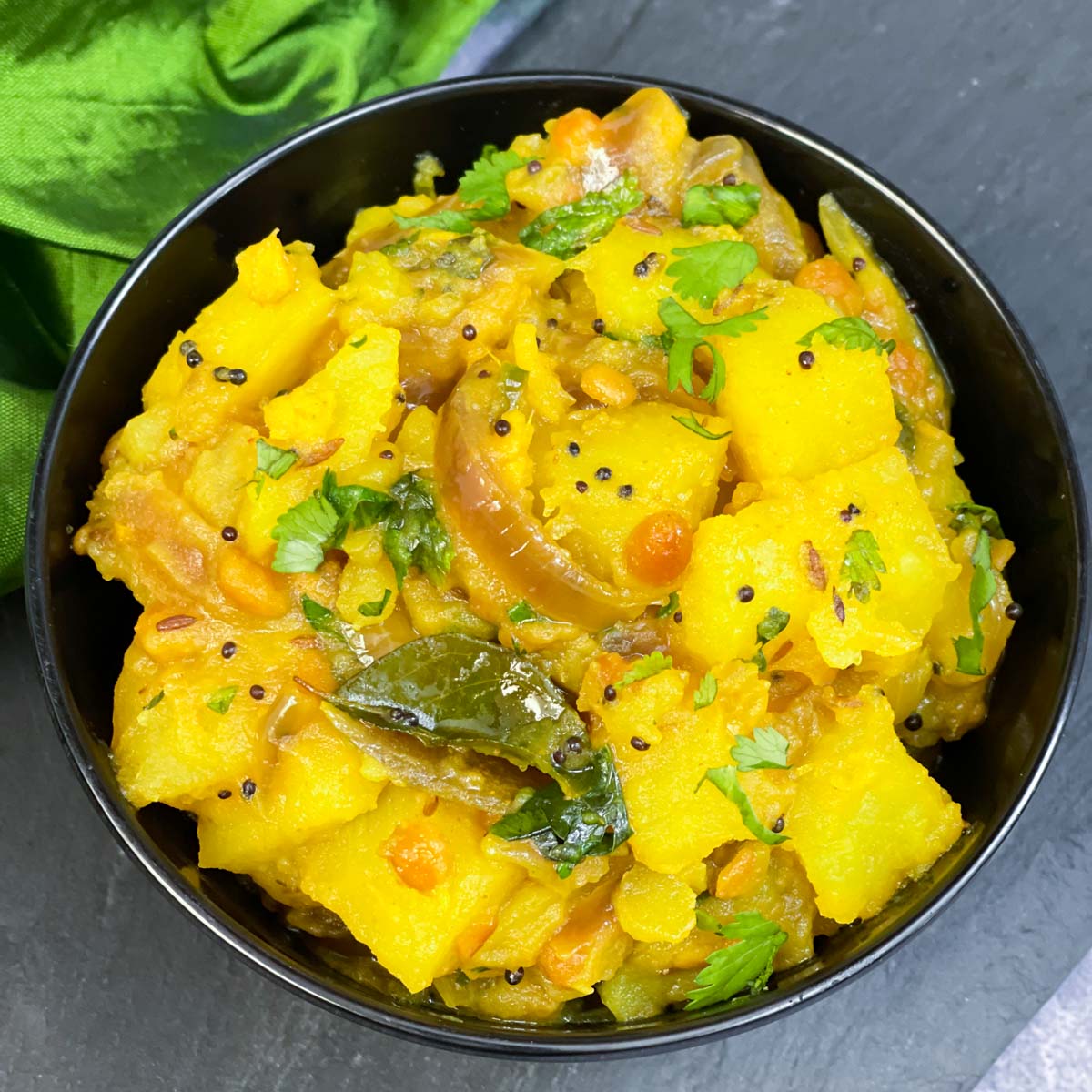 Aloo Masala — Turmeric-laced potatoes.. Served at Café Malabar, authentic Kerala & Malabar restaurant at 142 Arab Street, Singapore.