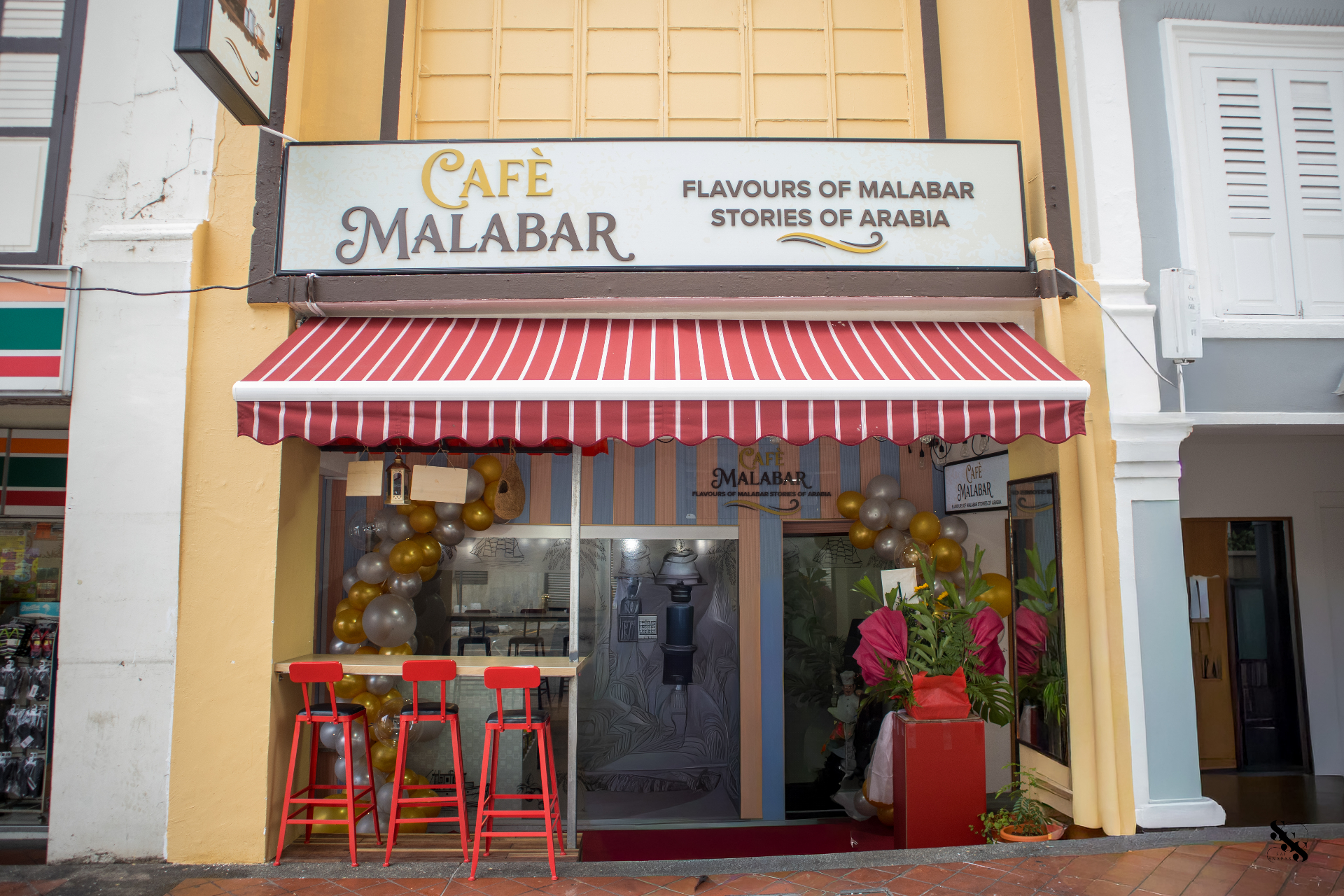 Hand-painted Café Malabar signage — Flavours of Malabar, Stories of Arabia