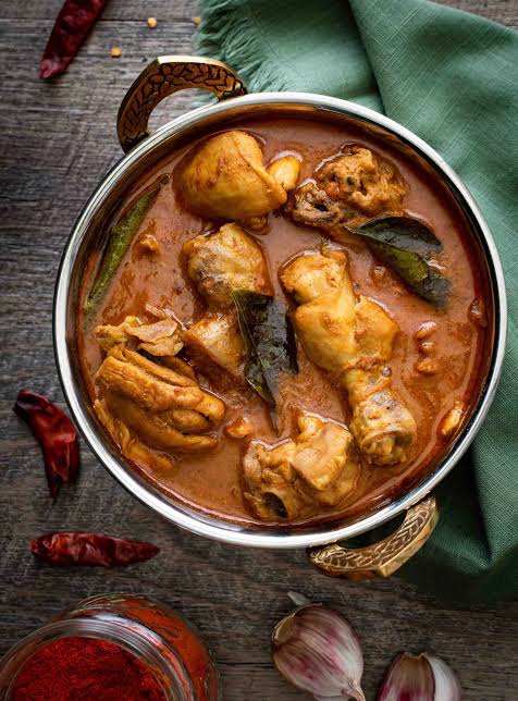 Signature Chicken Curry — Rustic gravy, generous with masala.. Served at Café Malabar, authentic Kerala & Malabar restaurant at 142 Arab Street, Singapore.