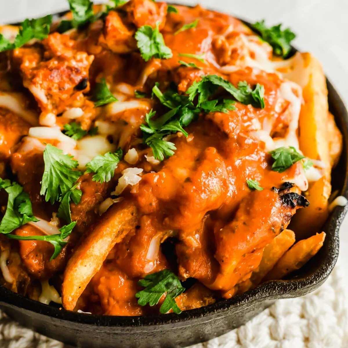Butter Chicken Loaded Fries. Served at Café Malabar, authentic Kerala & Malabar restaurant at 142 Arab Street, Singapore.