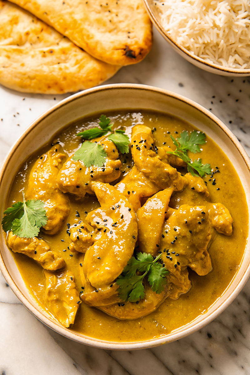 Mango Chicken Curry — Tangy mango-forward gravy.. Served at Café Malabar, authentic Kerala & Malabar restaurant at 142 Arab Street, Singapore.